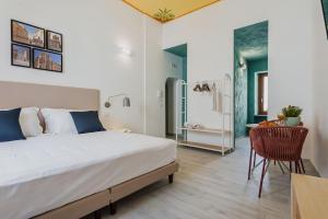 A bed or beds in a room at Five Stars Sicily by Ortigia Apartments