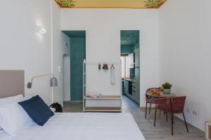 A bed or beds in a room at Five Stars Sicily by Ortigia Apartments