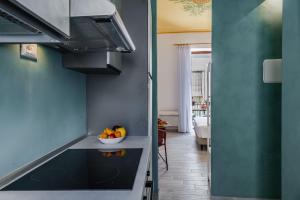 A kitchen or kitchenette at Five Stars Sicily by Ortigia Apartments