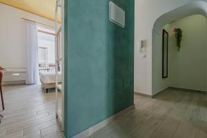 A bed or beds in a room at Five Stars Sicily by Ortigia Apartments