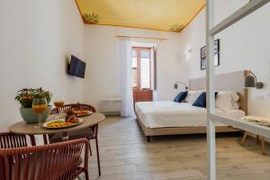 A bed or beds in a room at Five Stars Sicily by Ortigia Apartments