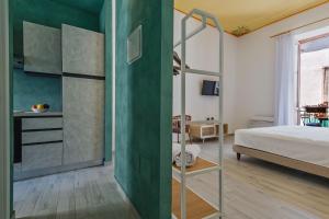 A bed or beds in a room at Five Stars Sicily by Ortigia Apartments