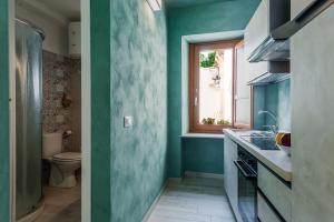 A bathroom at Five Stars Sicily by Ortigia Apartments