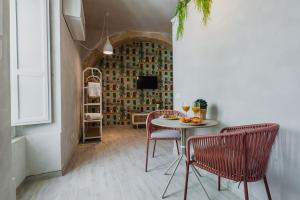 A seating area at Five Stars Sicily by Ortigia Apartments