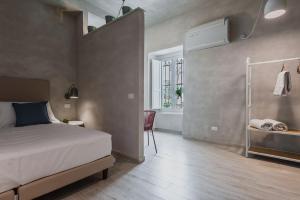 A bed or beds in a room at Five Stars Sicily by Ortigia Apartments