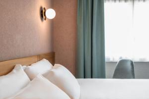 Postel nebo postele na pokoji v ubytování Sure Hotel by Best Western Centre Beaune