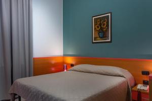 Postel nebo postele na pokoji v ubytování Hotel La Quercia