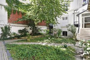 Vonkajšia záhrada v ubytovaní Charming apartment - 1BR-4P - Parc Monceau