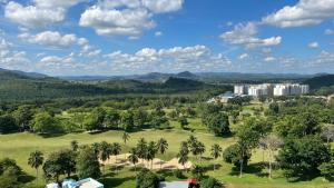 an aerial view of a park with palm trees and buildings at Condo D'Savoy @ Famosa, Malacca in Melaka
