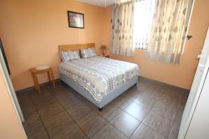 a bedroom with a bed and a window at Boulevard 114 in Margate