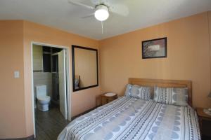 a bedroom with a bed and a bathroom at Boulevard 114 in Margate
