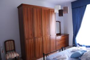 A bed or beds in a room at La casa di Valentino - grazioso ed ampio bilocale