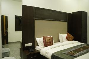 Postel nebo postele na pokoji v ubytování Hotel Anand Empire Near New Delhi Railway Station