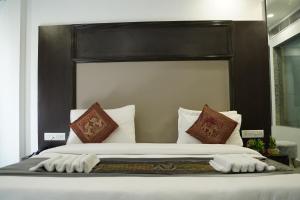 Postel nebo postele na pokoji v ubytování Hotel Anand Empire Near New Delhi Railway Station