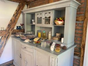 a kitchen with a counter with food on it at Land Gut Berlinchen in Berlinchen