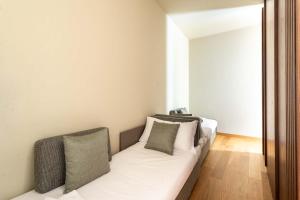 ELICAL Exclusive Private Suites客房内的一张或多张床位