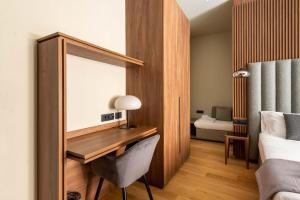 ELICAL Exclusive Private Suites客房内的一张或多张床位