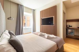 ELICAL Exclusive Private Suites客房内的一张或多张床位
