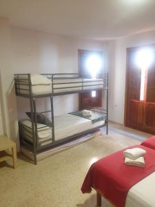 a room with two bunk beds in a room at 1D Apartamento con vistas a la Alhambra in Granada