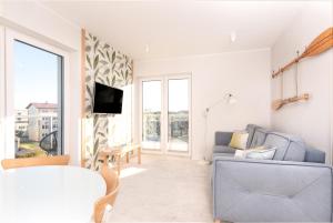 Telewizja i/lub zestaw kina domowego w obiekcie Al Mare - Apartamenty i pokoje