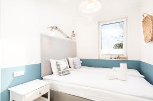 Łóżko lub łóżka w pokoju w obiekcie Al Mare - Apartamenty i pokoje