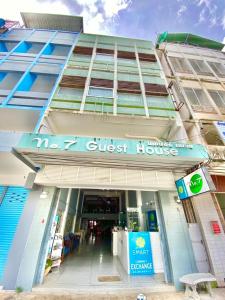 a building with a sign that reads we guest houses at No7 Guesthouse in Krabi town