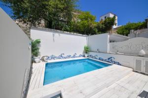a swimming pool in the backyard of a house at Queen Suite - Luxury Rooms in Ischia