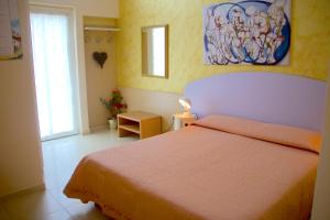 Postel nebo postele na pokoji v ubytování b&b il villino