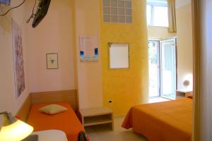 Postel nebo postele na pokoji v ubytování b&b il villino