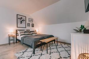 Postel nebo postele na pokoji v ubytování Kardamom Studio Apartman