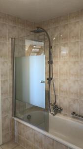 a shower with a glass door in a bathroom at Castorama in Rochehaut