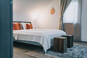 Postel nebo postele na pokoji v ubytování Kardamom Studio Apartman