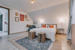 Postel nebo postele na pokoji v ubytování Kardamom Studio Apartman