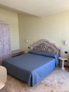 Postel nebo postele na pokoji v ubytování Hotel Marina Uno