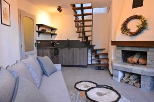 a living room with a couch and a fireplace at Marand Villas in Bansko