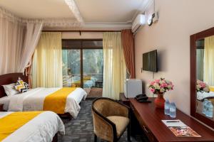 Krevet ili kreveti u jedinici u okviru objekta Entebbe Traveller's Hotel +16 fotografija