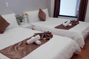 Postel nebo postele na pokoji v ubytování Minh Quan Hotel