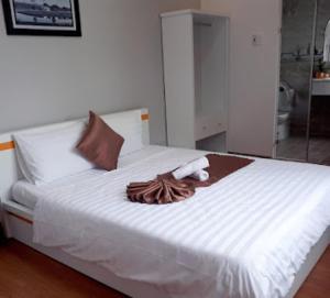 Postel nebo postele na pokoji v ubytování Minh Quan Hotel