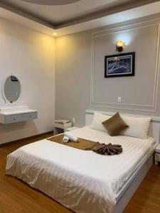 Postel nebo postele na pokoji v ubytování Minh Quan Hotel