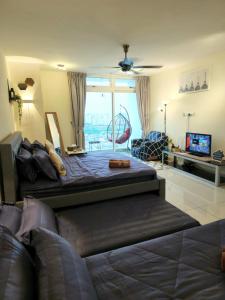 a living room with a bed and a couch at Ksl D'Esplanade Studio Apartment's 3 in Johor Bahru