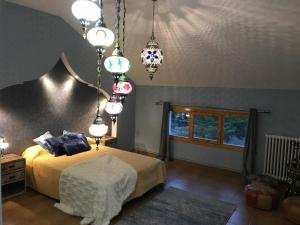 Postel nebo postele na pokoji v ubytování Hospedería Casa Martell