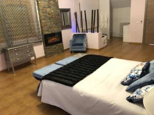 Postel nebo postele na pokoji v ubytování Hospedería Casa Martell