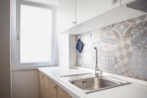 A kitchen or kitchenette at CASA MAIOLICA Még 33 kép