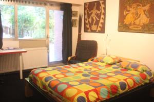 Postel nebo postele na pokoji v ubytování B&B Middelheim