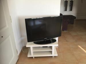 a television sitting on a white tv stand at Vista al Mar Ylenia in Almería