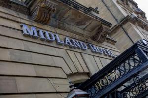 a sign on the side of a building at The Midland Hotel in Bradford