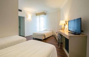 Postel nebo postele na pokoji v ubytování Etrusco Arezzo Hotel - Sure Hotel Collection by Best Western