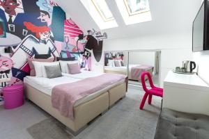 Postel nebo postele na pokoji v ubytování Butik Art Hotel