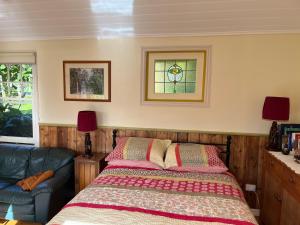 a bedroom with a bed and a window at The Dairy Cottage - Lake Lorne - Drysdale in Drysdale