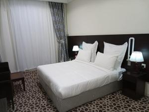 Postel nebo postele na pokoji v ubytování Abdul Hafez Al Humaidan Hotel
